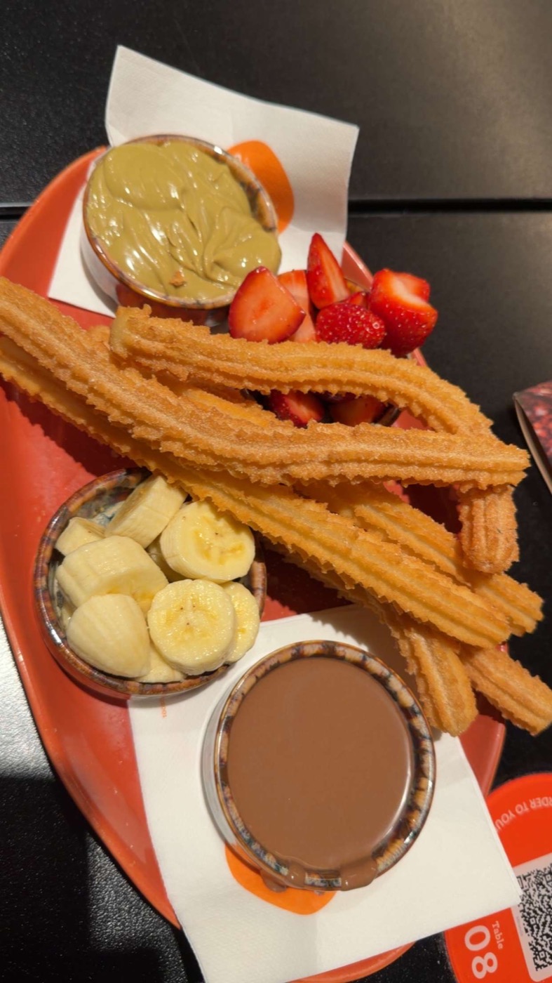 Churros with fruit and dipping chocolate